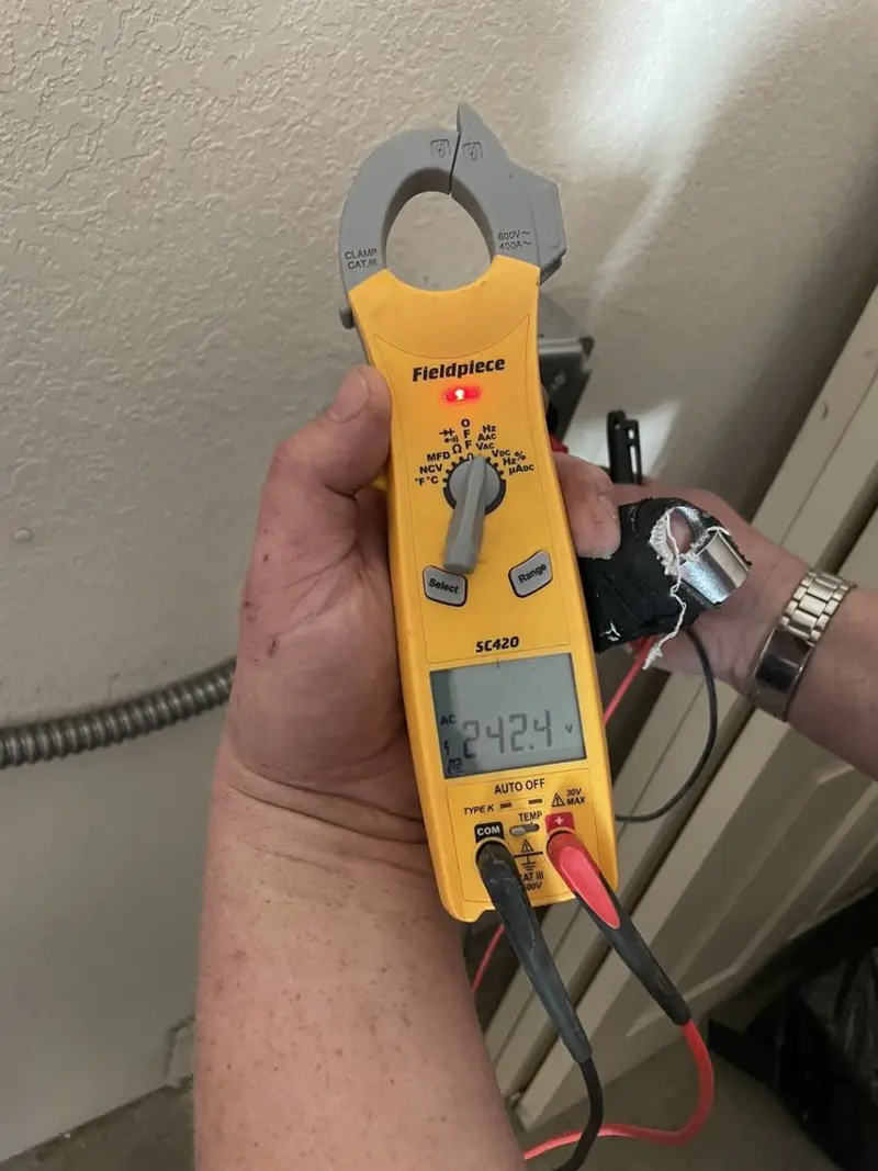 Voltage testing with clamp meter during Circuit Breaker Repair in Brimfield
